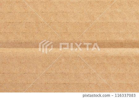 Corrugated cardboard box brown surface with fold lines. Recycled paper sheet texture background 116337083