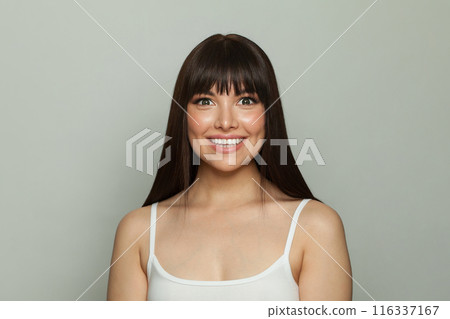 Happy healthy female model with clean skin, make-up and perfect hairstyle 116337167