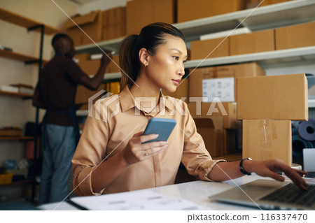Warehouse Worker Controlling Goods Online 116337470