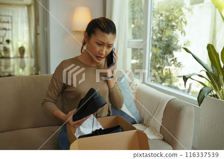 Woman Getting Shoes Of Small Size 116337539