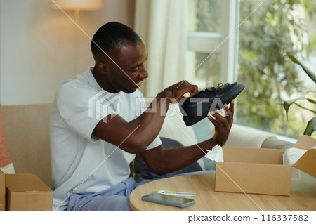 Man Checking His New Shoes Man Checking His New Shoes 116337582