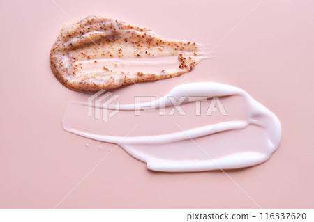 Cream and cream scrub on a pink background. Texture. 116337620