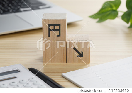 A building block with a circle down arrow on it 116338610
