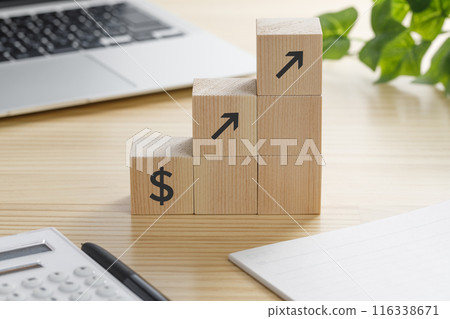 A building block with a $ up arrow on it A building block with a $ up arrow on it 116338671
