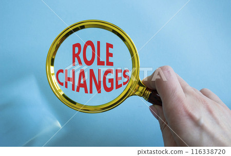 Role changes symbol. Concept words Role changes on magnifying glass. Businessman hand. Beautiful blue background. Business and Role changes concept. Copy space. Role changes symbol. Concept words Role changes on magnifying glass. Businessman hand. Beautiful blue background. Business and Role changes concept. Copy space. 116338720