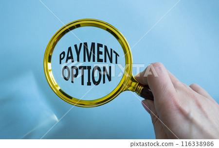 Payment Options symbol. Concept words Payment Options on magnifying glass. Businessman hand. Beautiful blue background. Business and Payment Options concept. Copy space. 116338986