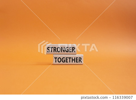 Stronger together symbol. Wooden blocks with words Stronger together. Beautiful orange background. Stronger together concept. Copy space. Stronger together symbol. Wooden blocks with words Stronger together. Beautiful orange background. Stronger together concept. Copy space. 116339007