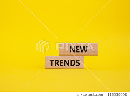 New Trends symbol. Wooden blocks with words New Trends. Beautiful yellow background. Business and New Trends concept. Copy space. New Trends symbol. Wooden blocks with words New Trends. Beautiful yellow background. Business and New Trends concept. Copy space. 116339008
