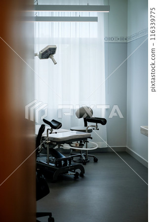 Office of a doctor urologist in a medical clinic with a specialized bed 116339775