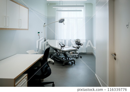 Office of a doctor urologist in a medical clinic with a specialized bed 116339776