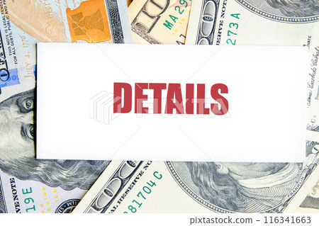 Business concept. DETAILS words on a business card against the background of dollar bills Business concept. DETAILS words on a business card against the background of dollar bills 116341663