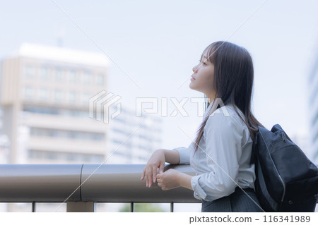 A high school girl with a bag in the city 116341989
