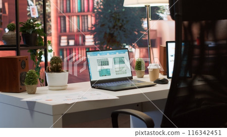 Empty home office setup showing documents and financial reports on laptop, desk used for a person to work on market analytics and accountancy. Organizational budget balance analysis. Empty home office setup showing documents and financial reports on laptop, desk used for a person to work on market analytics and accountancy. Organizational budget balance analysis. 116342451