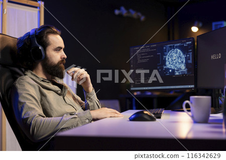 Programmer getting interrupted by AI becoming sentient while listening music, saluting and asking questions about itself. Artificial intelligence becoming self aware, greeting man wearing headphones 116342629