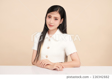 Beautiful young asian woman with clean fresh skin on beige background, Face care, Facial treatment, Cosmetology, beauty and spa, Asian women portrait. 116342882