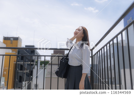 School girls standing on the roof 116344569