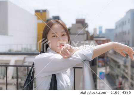 School girls standing on the roof 116344586