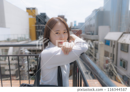 School girls standing on the roof 116344587