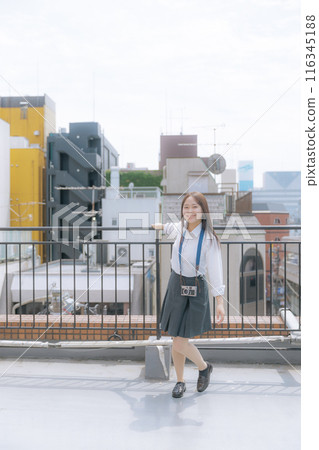 High school girl using a film camera High school girl using a film camera 116345188