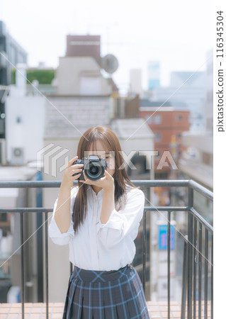 high school girl with camera high school girl with camera 116345304