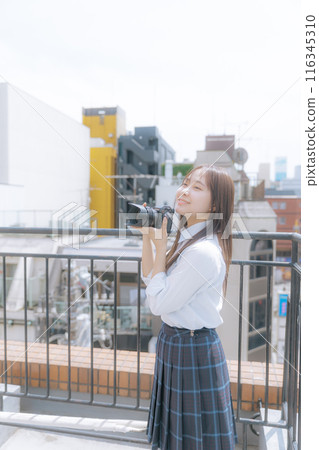 high school girl with camera 116345310