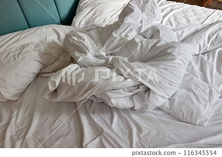 Messy hotel bed closeup Messy hotel bed closeup 116345554