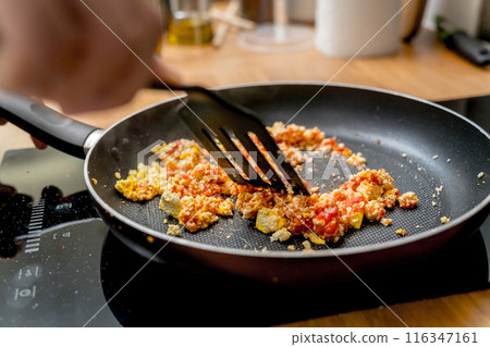 Chef at the kitchen preparing quesadillas with tofu and sweet corn 116347161
