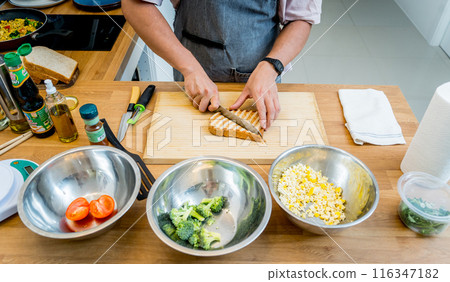 Chef cooking white bread toasted on an electric grill 116347182