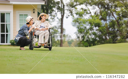 Elderly Woman in Wheelchair with Daughter by Her Side Elderly Woman in Wheelchair with Daughter by Her Side 116347282