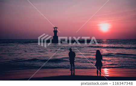 A lighthouse in the ocean during a beautiful sunset A lighthouse in the ocean during a beautiful sunset 116347348
