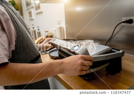 Chef cooking white bread toasted on an electric grill Chef cooking white bread toasted on an electric grill 116347437