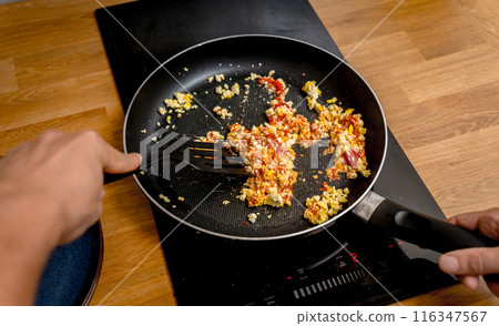 Chef at the kitchen preparing quesadillas with tofu and sweet corn Chef at the kitchen preparing quesadillas with tofu and sweet corn 116347567