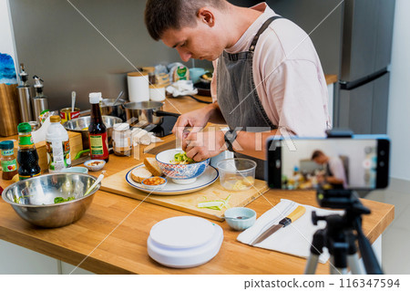 The chef is broadcasting live from workshop how to prepare a vegetarian food The chef is broadcasting live from workshop how to prepare a vegetarian food 116347594