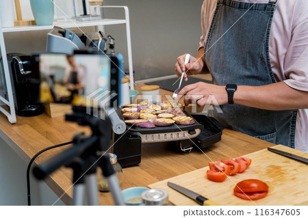 The chef is broadcasting live from workshop how to prepare a grilled eggplants with garlic The chef is broadcasting live from workshop how to prepare a grilled eggplants with garlic 116347605