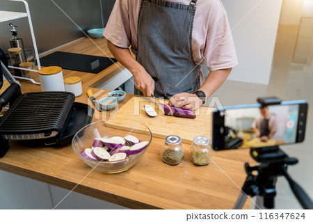 The chef is broadcasting live from workshop how to prepare a grilled eggplants with garlic The chef is broadcasting live from workshop how to prepare a grilled eggplants with garlic 116347624
