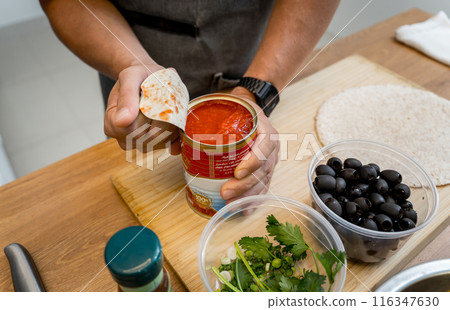 Chef at the kitchen preparing quesadillas with tofu and sweet corn 116347630