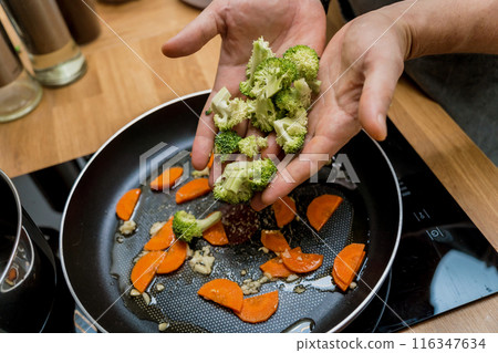 Chef at the kitchen preparing japanese buckwheat pasta with lentils Chef at the kitchen preparing japanese buckwheat pasta with lentils 116347634