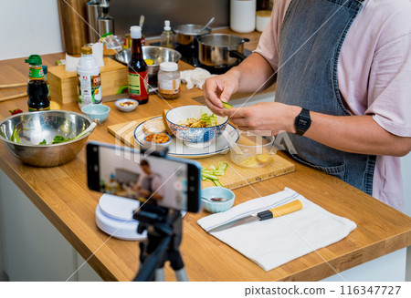 The chef is broadcasting live from workshop how to prepare a vegetarian food 116347727