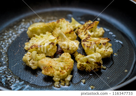 Chef at the kitchen preparing bean porridge with cauliflower and vegetables Chef at the kitchen preparing bean porridge with cauliflower and vegetables 116347733
