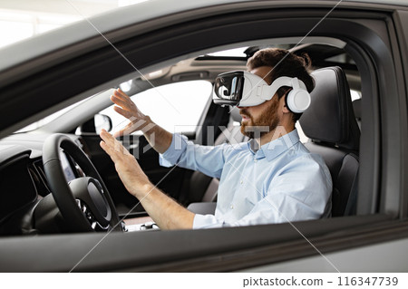 Businessman using virtual reality inside car at dealership 116347739