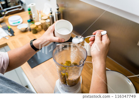 Chef at the kitchen preparing chickpea porridge with ginger Chef at the kitchen preparing chickpea porridge with ginger 116347749
