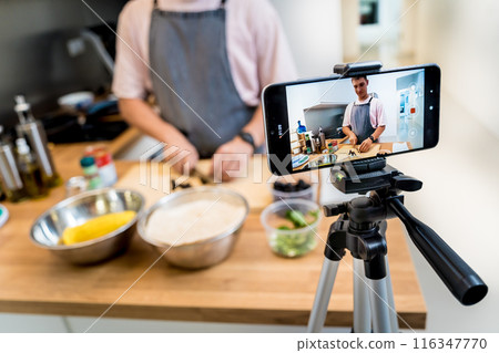 The chef is broadcasting live from workshop how to prepare a vegetarian food 116347770