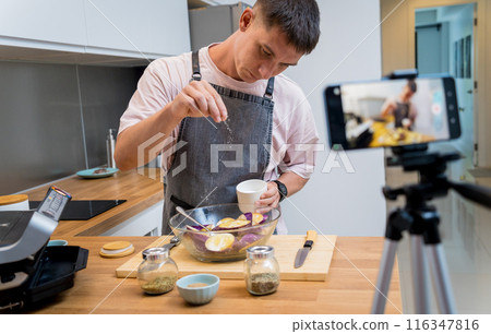 The chef is broadcasting live from workshop how to prepare a grilled eggplants with garlic The chef is broadcasting live from workshop how to prepare a grilled eggplants with garlic 116347816