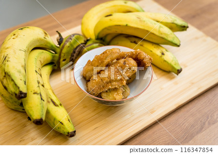 Crispy fried bananas in the small white bowl Crispy fried bananas in the small white bowl 116347854