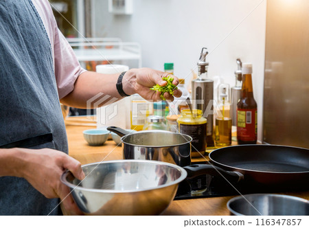 Chef at the kitchen preparing lentils soup with cauliflower and broccoli Chef at the kitchen preparing lentils soup with cauliflower and broccoli 116347857