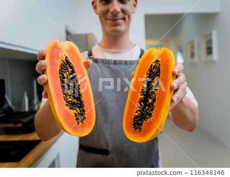 Chef cuts and peels papaya on the cutting board Chef cuts and peels papaya on the cutting board 116348146