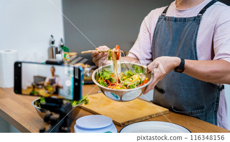 The chef is broadcasting live from workshop how to prepare a spicy glass noodle salad 116348156