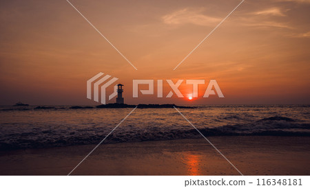 A lighthouse in the ocean during a beautiful sunset A lighthouse in the ocean during a beautiful sunset 116348181