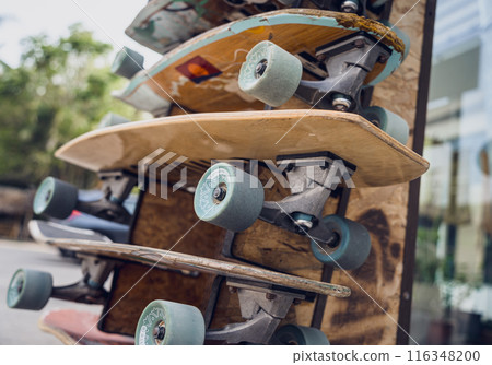 A stack of skateboards on a special outdoor stand A stack of skateboards on a special outdoor stand 116348200