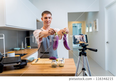 The chef is broadcasting live from workshop how to prepare a grilled eggplants with garlic The chef is broadcasting live from workshop how to prepare a grilled eggplants with garlic 116348215